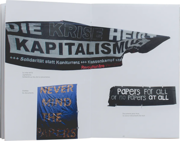 Open book. Layout of three protest banners. The banners have been cut out of their original photos and seem to be floating across the two pages. One of them read in German 
