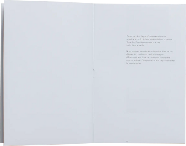 Open book. Simple layout with text on the right page. The text is written in French and takes on the humanist idea for having a free world where everyone can belong anywhere. 