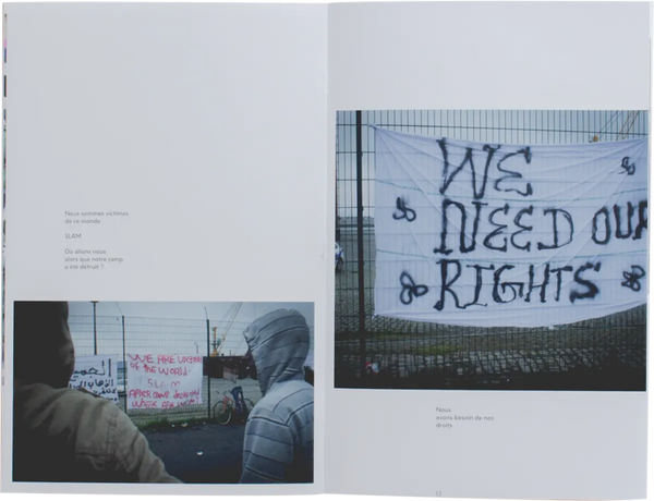 Open book. Layout shows two photos and some text. The photos show two banners improvised with bed sheets and spray paint. The banners read 